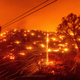 Seen in a long exposure photograph, embers burn along a hillside as the LNU Lightning Complex fires tear through Napa County on Tuesday, Aug. 18, 2020.